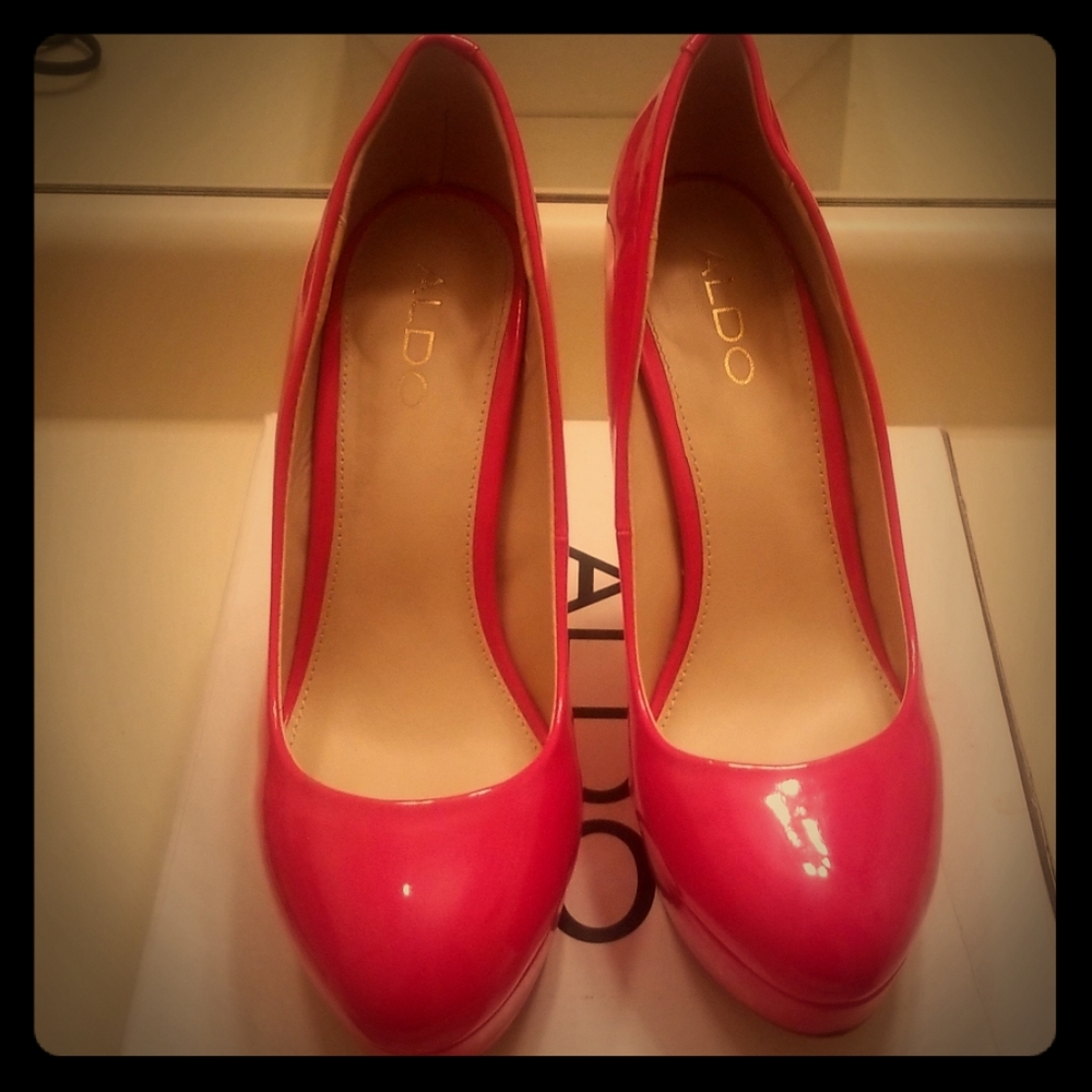 Never worn red Aldo pumps.